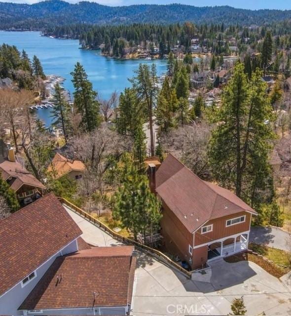 birds eye view of property featuring a water view