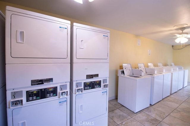 washroom with ceiling fan, independent washer and dryer, stacked washing maching and dryer, and light tile patterned floors