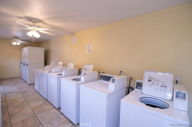 washroom with light tile patterned floors, independent washer and dryer, and ceiling fan