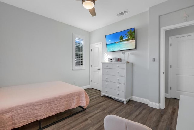 bedroom with ceiling fan and dark hardwood / wood-style floors