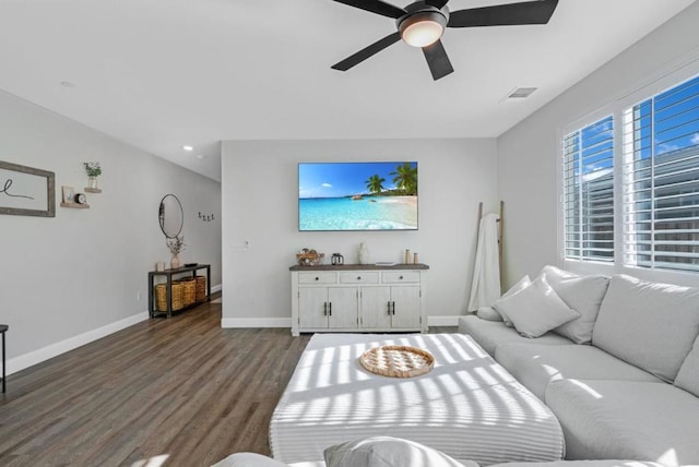 living room with hardwood / wood-style floors and ceiling fan