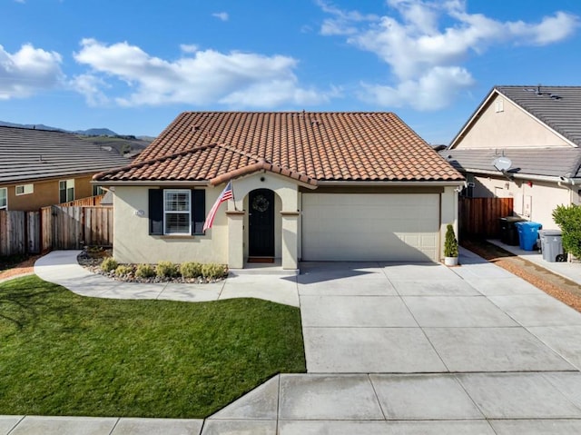 view of front of property with a garage and a front yard