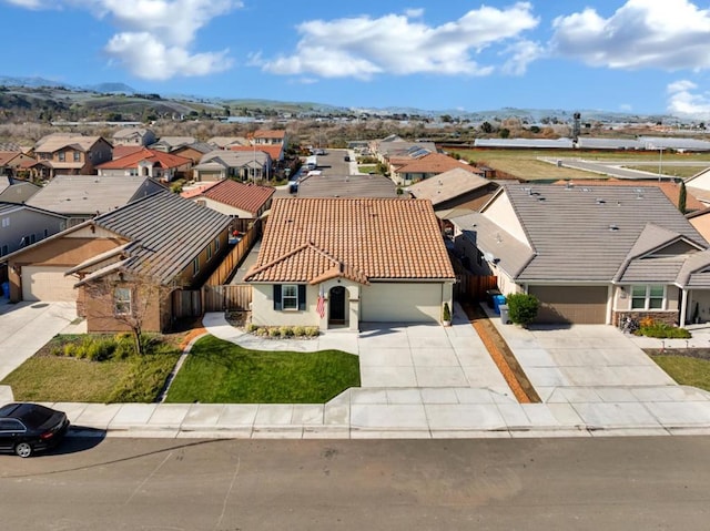 birds eye view of property with a mountain view