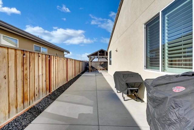 view of patio featuring a gazebo and grilling area