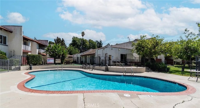 view of pool featuring a patio area