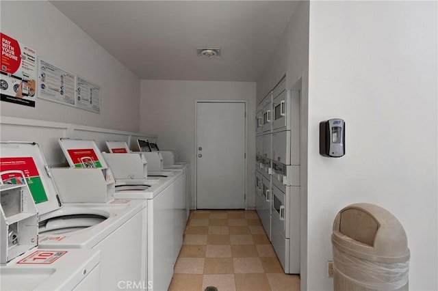 laundry room with stacked washer / drying machine and washer and dryer