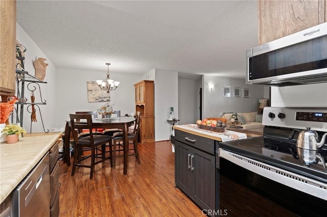 23617 Golden Springs Dr Unit K19, Diamond Bar, CA 91765 - kitchen with stainless steel appliances, wood finished floors, a chandelier, light countertops, and a textured ceiling