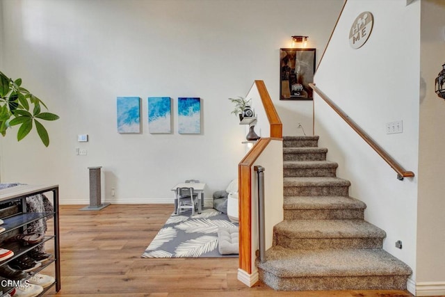 stairway featuring hardwood / wood-style floors