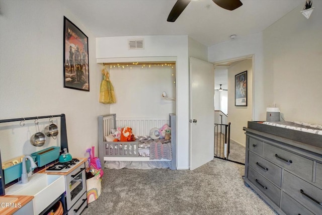 carpeted bedroom featuring ceiling fan