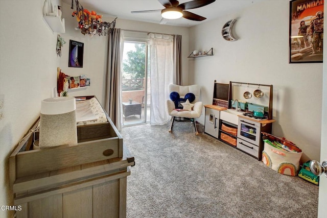 recreation room with ceiling fan and carpet floors