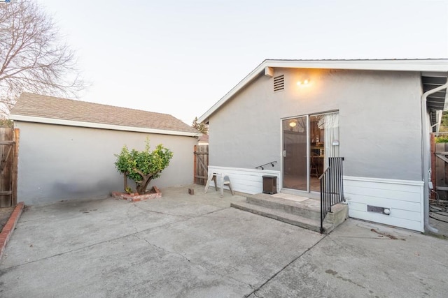 back of house with a patio