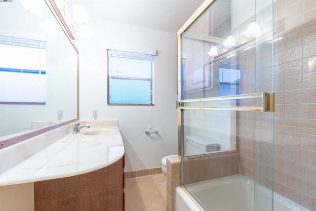 full bathroom with vanity, tile patterned floors, enclosed tub / shower combo, and toilet