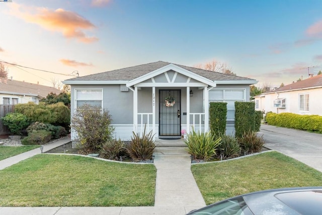 bungalow-style home featuring a lawn