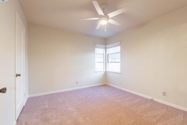 unfurnished room with ceiling fan and light colored carpet