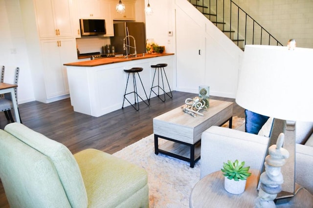 living room with dark wood-type flooring