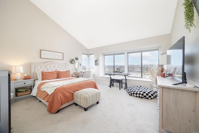 bedroom with high vaulted ceiling and carpet floors