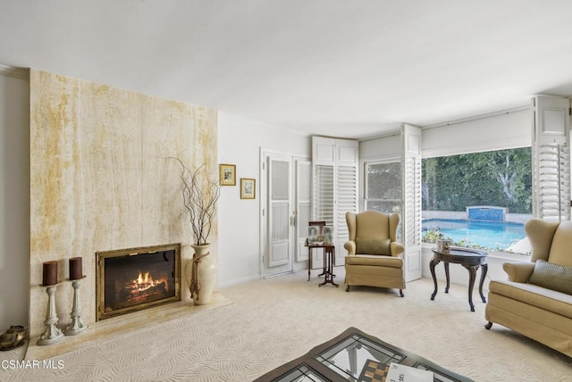 carpeted living room with a fireplace