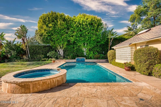 view of pool with a patio area and an in ground hot tub