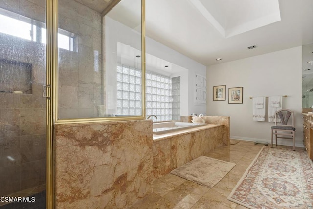 bathroom with shower with separate bathtub