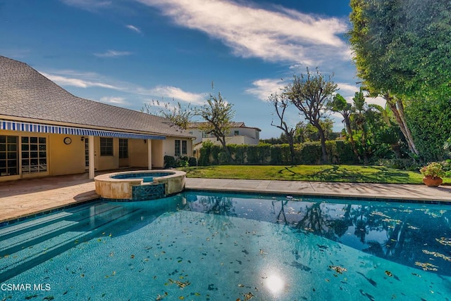 view of swimming pool with an in ground hot tub, a yard, and a patio