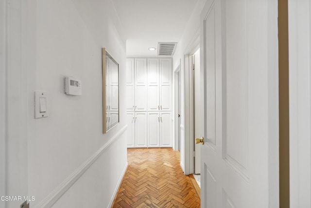 corridor with light parquet flooring