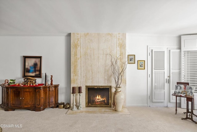 living room featuring crown molding and light colored carpet