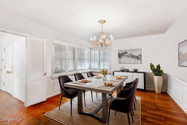 dining area with an inviting chandelier