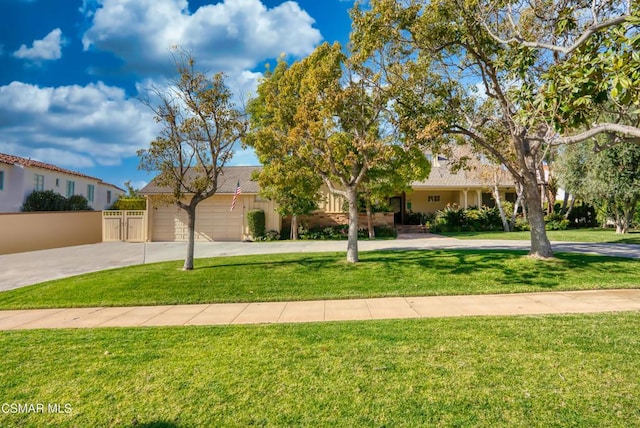 view of front facade with a garage and a front lawn