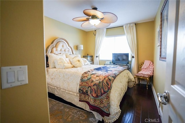 bedroom featuring ceiling fan and dark hardwood / wood-style flooring