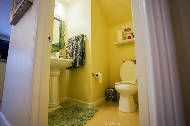 bathroom with tile patterned flooring and toilet