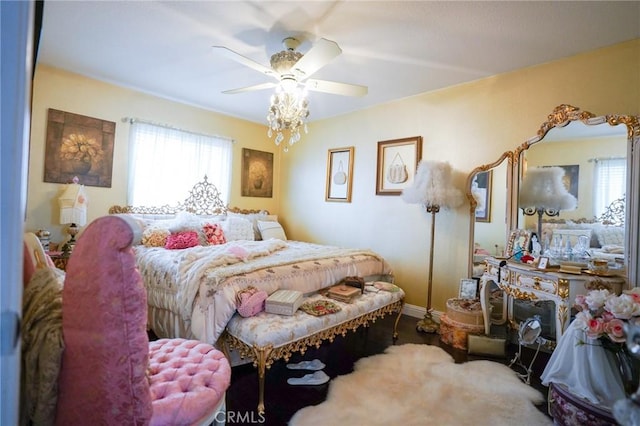 bedroom with multiple windows, carpet flooring, and ceiling fan