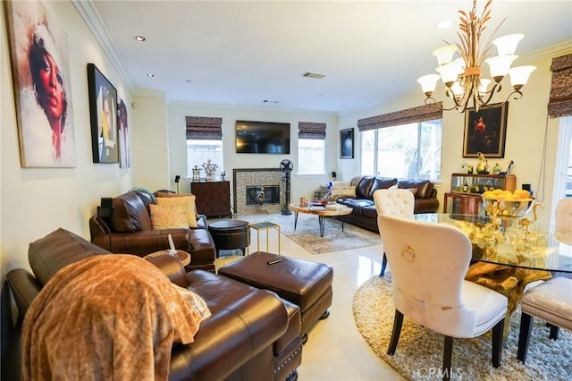 living room with crown molding and a chandelier