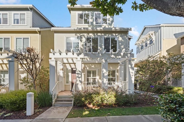 view of front of house with a pergola