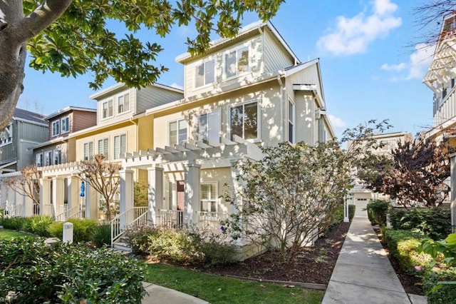 view of front of property with a pergola