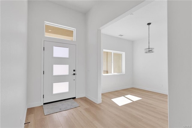 18554 Temecula Ave, Hesperia, CA 92345 - foyer entrance featuring plenty of natural light, light wood-type flooring, and baseboards