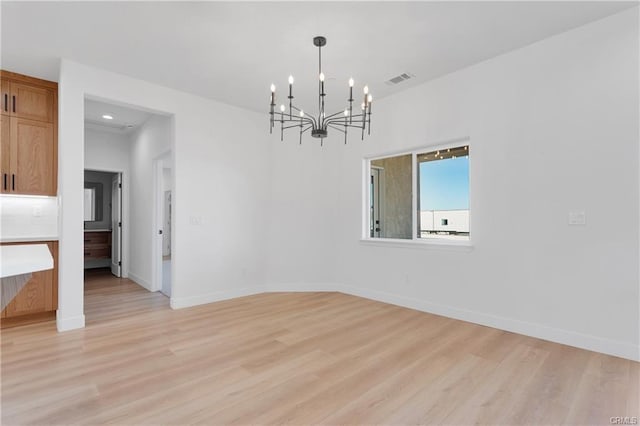 18554 Temecula Ave, Hesperia, CA 92345 - unfurnished dining area with light wood-style floors, a chandelier, baseboards, and recessed lighting