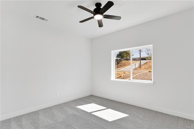 empty room with carpet and ceiling fan