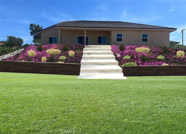 18554 Temecula Ave, Hesperia, CA 92345 - ranch-style home with stucco siding and a front lawn