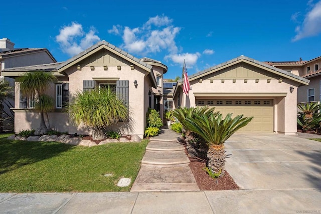 view of front of property featuring a garage and a front lawn