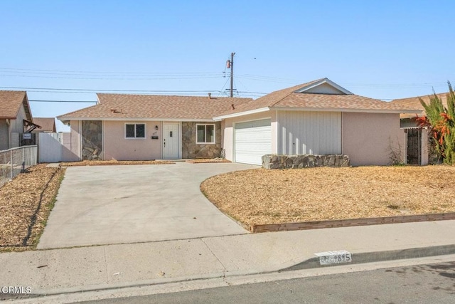 ranch-style house featuring a garage