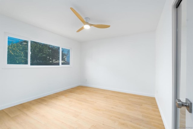 unfurnished room with ceiling fan and light hardwood / wood-style flooring