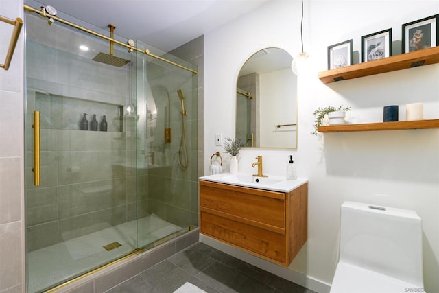 bathroom featuring an enclosed shower, vanity, tile patterned floors, and toilet