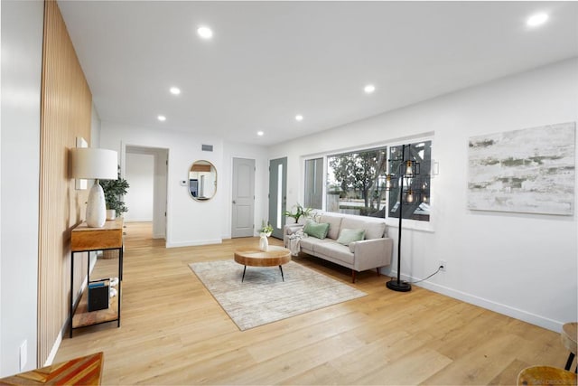 living room with light hardwood / wood-style flooring