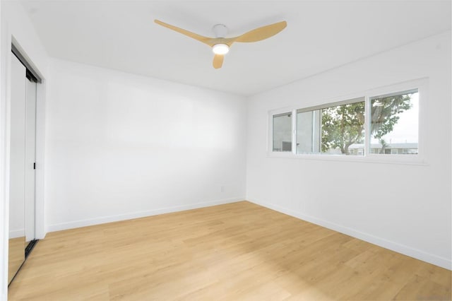 spare room with ceiling fan and light hardwood / wood-style floors