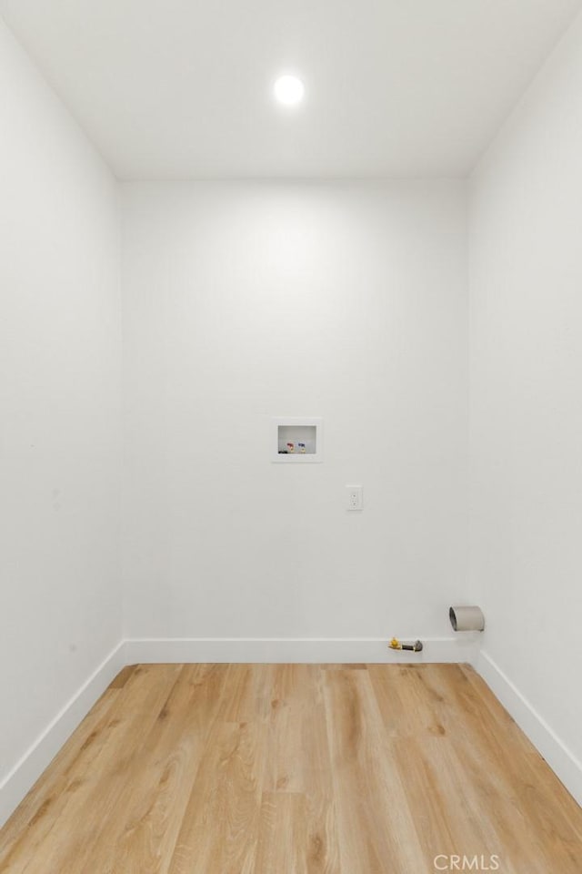 laundry room featuring hardwood / wood-style floors and washer hookup