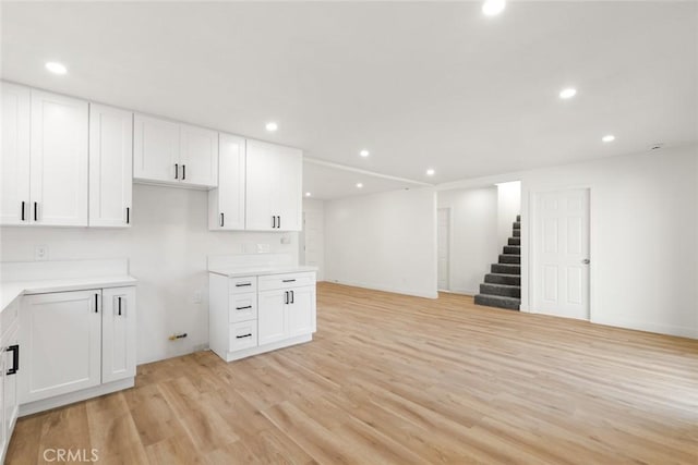 kitchen featuring white cabinetry and light hardwood / wood-style flooring