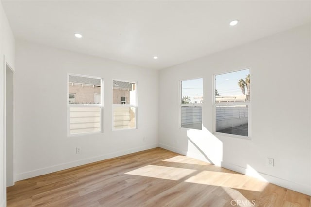 unfurnished room featuring light wood-type flooring