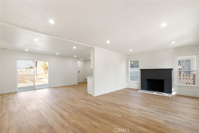 unfurnished living room with light hardwood / wood-style flooring