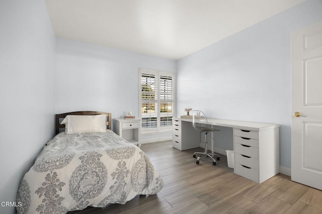 bedroom with light hardwood / wood-style flooring