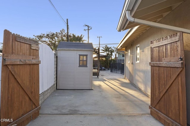 view of patio / terrace with a shed